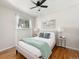 Bedroom with hardwood floors, neutral walls and large window for plenty of natural light at 6223 Gray St, Arvada, CO 80003