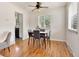 Cozy dining area with a modern table set and natural light from a window at 6223 Gray St, Arvada, CO 80003