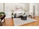 Bright living room with hardwood floors and a cozy seating area at 6223 Gray St, Arvada, CO 80003