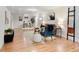Bright living room with hardwood floors, comfortable seating, and a decorative rug for a welcoming atmosphere at 6223 Gray St, Arvada, CO 80003
