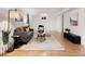Inviting living room with hardwood floors, neutral walls, and modern furniture at 6223 Gray St, Arvada, CO 80003