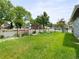 Manicured backyard lawn with a border flowerbed and a tall wooden privacy fence at 6223 Gray St, Arvada, CO 80003