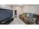 Partially finished basement with TV and comfy seating at 13275 Holly St # E, Thornton, CO 80241