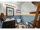 Stylish half bathroom with unique decor, a vanity, and a well-placed mirror at 13275 Holly St # E, Thornton, CO 80241