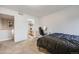 This cozy bedroom is adjacent to the bathroom and office at 13275 Holly St # E, Thornton, CO 80241