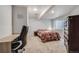 Game room or basement bedroom with window, closet, and neutral decor at 13275 Holly St # E, Thornton, CO 80241