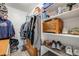 Functional walk-in closet with shelving and drawers for optimal storage at 13275 Holly St # E, Thornton, CO 80241