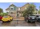 Inviting townhome features a well-maintained exterior, convenient parking, and a neatly landscaped front yard at 13275 Holly St # E, Thornton, CO 80241