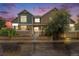 Charming exterior with stone accents and fresh landscaping, creating a welcoming curb appeal at 13275 Holly St # E, Thornton, CO 80241