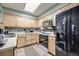 Well-equipped kitchen with modern appliances, efficient layout, and ample storage space at 13275 Holly St # E, Thornton, CO 80241