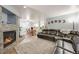 Open-concept living area with a fireplace, dining space, and seamless flow for entertaining guests at 13275 Holly St # E, Thornton, CO 80241