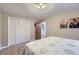 Cozy bedroom featuring a full closet, neutral tones, soft carpet, and simple decor at 424 Peery Pkwy, Golden, CO 80403