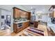 Modern kitchen with stainless steel appliances, stone backsplash, and wooden cabinets at 424 Peery Pkwy, Golden, CO 80403