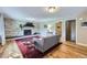 Bright living room featuring hardwood floors, a stacked stone fireplace and neutral paint at 424 Peery Pkwy, Golden, CO 80403