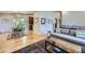 Open-concept living area with wood floors and a dining space at 424 Peery Pkwy, Golden, CO 80403