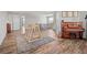 A second floor living area with hardwood floors, an activity center, and natural light at 19887 Kershaw Ct, Monument, CO 80132