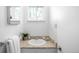 Bright bathroom with white sink and granite countertops at 3322 Simms St, Wheat Ridge, CO 80033