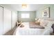 Comfortable bedroom features soothing walls, bright lighting, and stylish decor elements at 3322 Simms St, Wheat Ridge, CO 80033