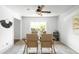 Dining room features modern table, stylish chairs, and bright windows for ample light at 3322 Simms St, Wheat Ridge, CO 80033