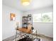 Well-lit office featuring modern desk, stylish rug, and shelves for optimal work from home at 3322 Simms St, Wheat Ridge, CO 80033