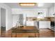 Bright, modern kitchen with stainless steel appliances, white cabinetry, and a spacious center island at 3322 Simms St, Wheat Ridge, CO 80033