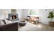 Spacious living room with fireplace, modern furniture, and plenty of natural light at 3322 Simms St, Wheat Ridge, CO 80033