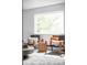 Comfortable sitting area bathed in natural light, featuring cozy seating and stylish decor at 3322 Simms St, Wheat Ridge, CO 80033