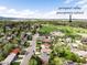 Neighborhood view near Prospect Valley Elementary School, with a vast green field and mountain backdrop at 3322 Simms St, Wheat Ridge, CO 80033