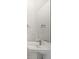 Bright powder room with modern sink, large mirror, and sleek fixtures at 3909 Piney Grove St, Evergreen, CO 80439
