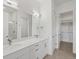 Elegant bathroom features double sinks, quartz countertop, large mirror, and stylish fixtures at 3909 Piney Grove St, Evergreen, CO 80439
