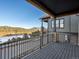 Inviting deck with wood-like flooring offers picturesque views of mountains and the neighborhood at 3909 Piney Grove St, Evergreen, CO 80439