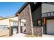 Inviting entryway with stone pillars leading to the front door of the house at 3909 Piney Grove St, Evergreen, CO 80439