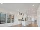 Well-lit kitchen featuring stainless appliances, a large island and views of the outdoors at 3909 Piney Grove St, Evergreen, CO 80439