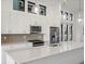 Modern kitchen featuring a center island, stainless steel appliances, and sleek lighting fixtures at 3909 Piney Grove St, Evergreen, CO 80439