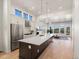 Bright, modern kitchen with stainless steel appliances and a large center island at 3909 Piney Grove St, Evergreen, CO 80439