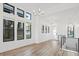 Bright, airy living room with large windows and modern light fixtures, showcasing sleek design at 3909 Piney Grove St, Evergreen, CO 80439