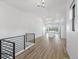 Spacious living area with stairs, showcasing sleek railings and open layout to the kitchen at 3909 Piney Grove St, Evergreen, CO 80439
