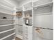 Customized walk-in closet featuring shelves, drawers, and hanging rods for optimal organization at 3909 Piney Grove St, Evergreen, CO 80439