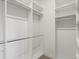 Walk-in closet with white shelving and ample hanging space for organized storage at 3909 Piney Grove St, Evergreen, CO 80439