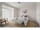 Inviting bedroom with plush textiles, modern art, and a sun-drenched window at 7440 S Blackhawk St # 2-108, Englewood, CO 80112