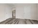 Bedroom with gray floors, white walls, a doorway to the bathroom, and a closet door at 7440 S Blackhawk St # 2-108, Englewood, CO 80112