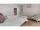 Comfortable bedroom showing relaxing design with neutral decor and view into bathroom at 7440 S Blackhawk St # 2-108, Englewood, CO 80112