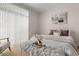 Relaxing bedroom features neutral decor, cozy textures, and ample natural light at 7440 S Blackhawk St # 2-108, Englewood, CO 80112