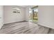 Bedroom with gray floors, lots of light from a sliding glass door, and two outlets at 7440 S Blackhawk St # 2-108, Englewood, CO 80112
