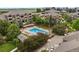 Aerial view of the community pool with plenty of seating for residents to relax and enjoy the outdoors at 7440 S Blackhawk St # 2-108, Englewood, CO 80112