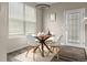 Cozy dining area boasts natural light and stylish chairs, perfect for intimate gatherings at 7440 S Blackhawk St # 2-108, Englewood, CO 80112