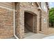 Arched stone entryway to a condo building, featuring a staircase and stone accents at 7440 S Blackhawk St # 2-108, Englewood, CO 80112