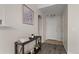 Inviting condo entryway with modern flooring, neutral walls, and decor shelf at 7440 S Blackhawk St # 2-108, Englewood, CO 80112