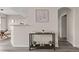 Inviting condo entryway with modern flooring, neutral walls, and decor shelf at 7440 S Blackhawk St # 2-108, Englewood, CO 80112