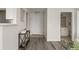 Inviting condo entryway with modern flooring, neutral walls, and decor shelf at 7440 S Blackhawk St # 2-108, Englewood, CO 80112